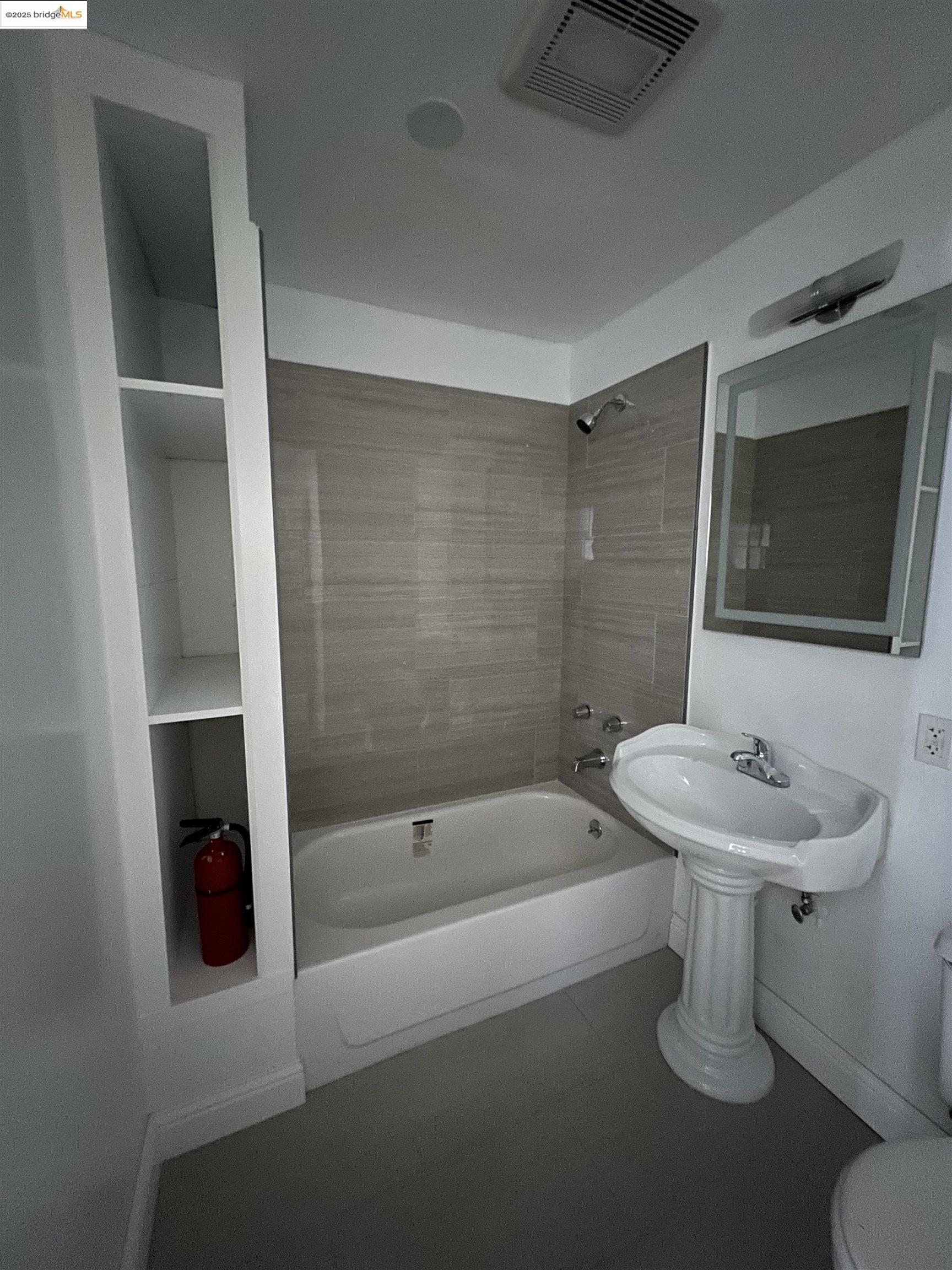 3244 Ellis Street, Unit D Berkeley, CA 94703 - Photo 7 of 7 a bathroom with a sink a toilet and shower