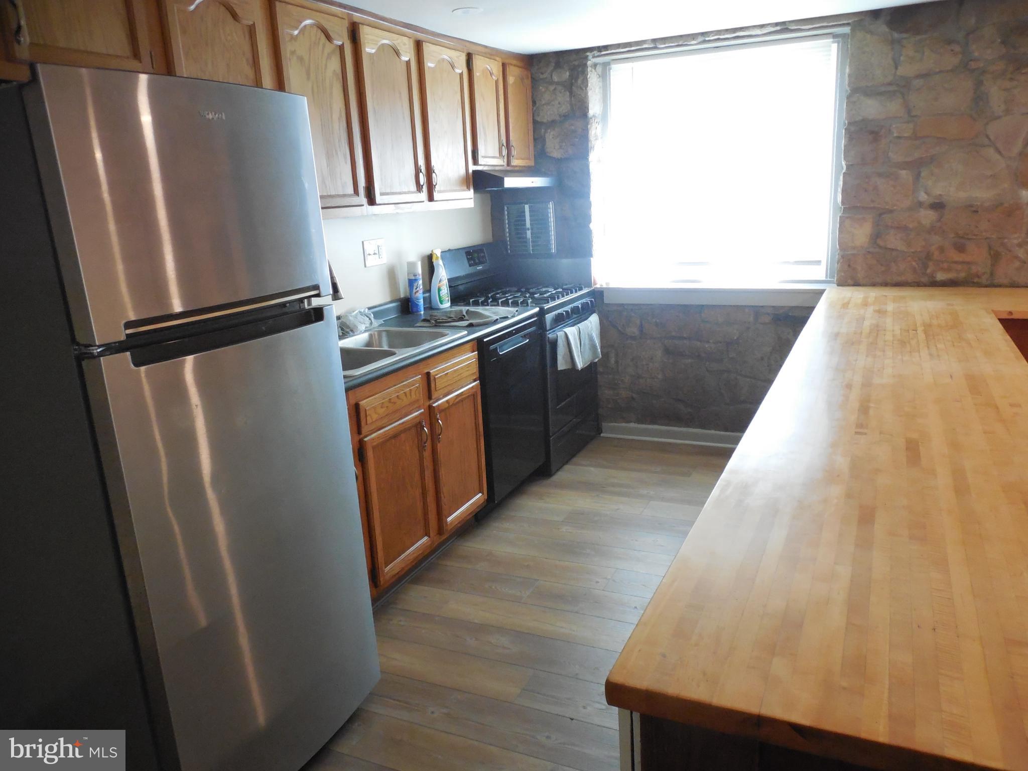 20 Camp Rock Hill Road Quakertown, PA 18951 - Photo 14 of 27 a kitchen with stainless steel appliances granite countertop a refrigerator a sink and a stove