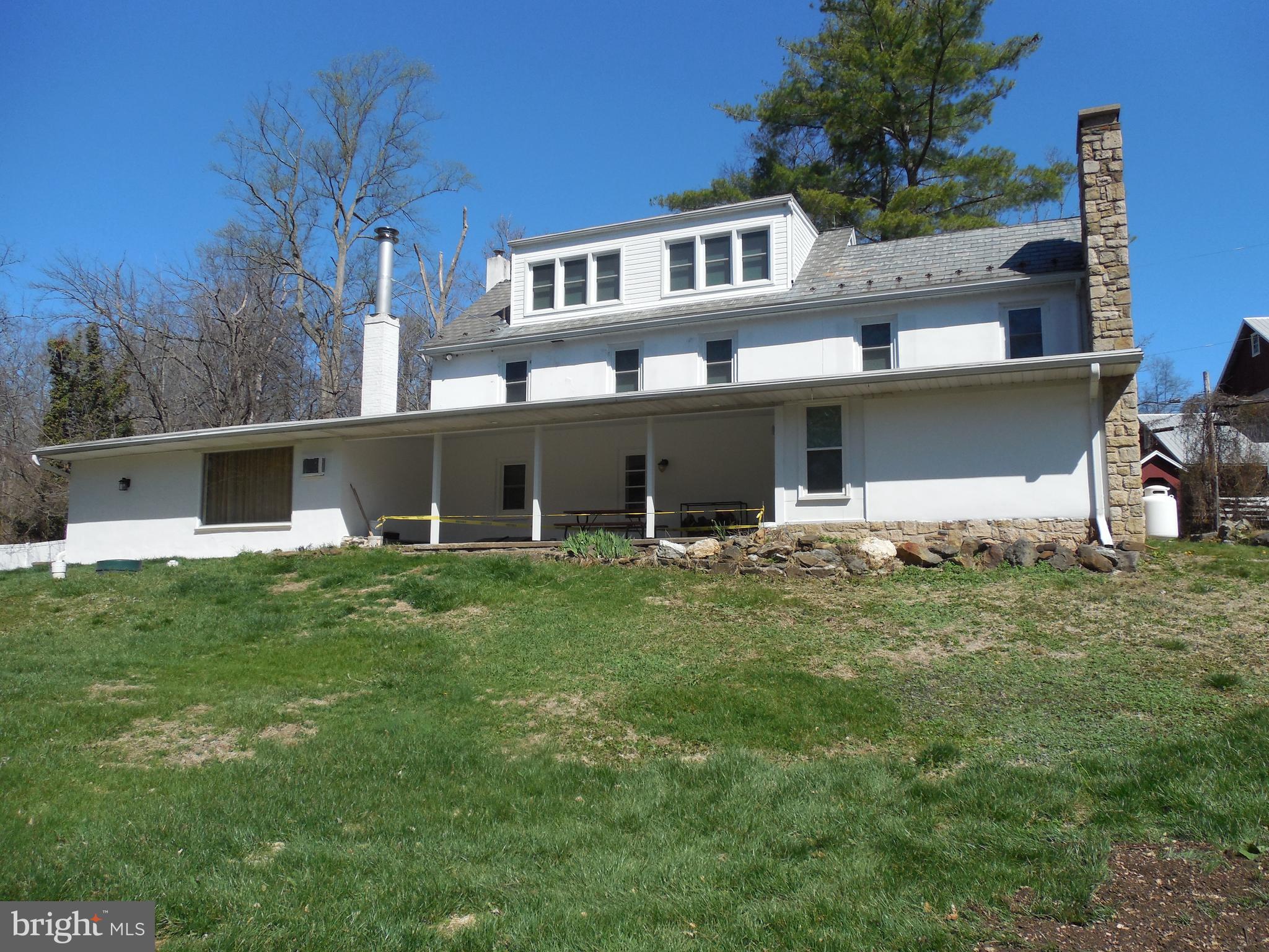 20 Camp Rock Hill Road Quakertown, PA 18951 - Photo 4 of 27 a backyard of a house with table and chairs
