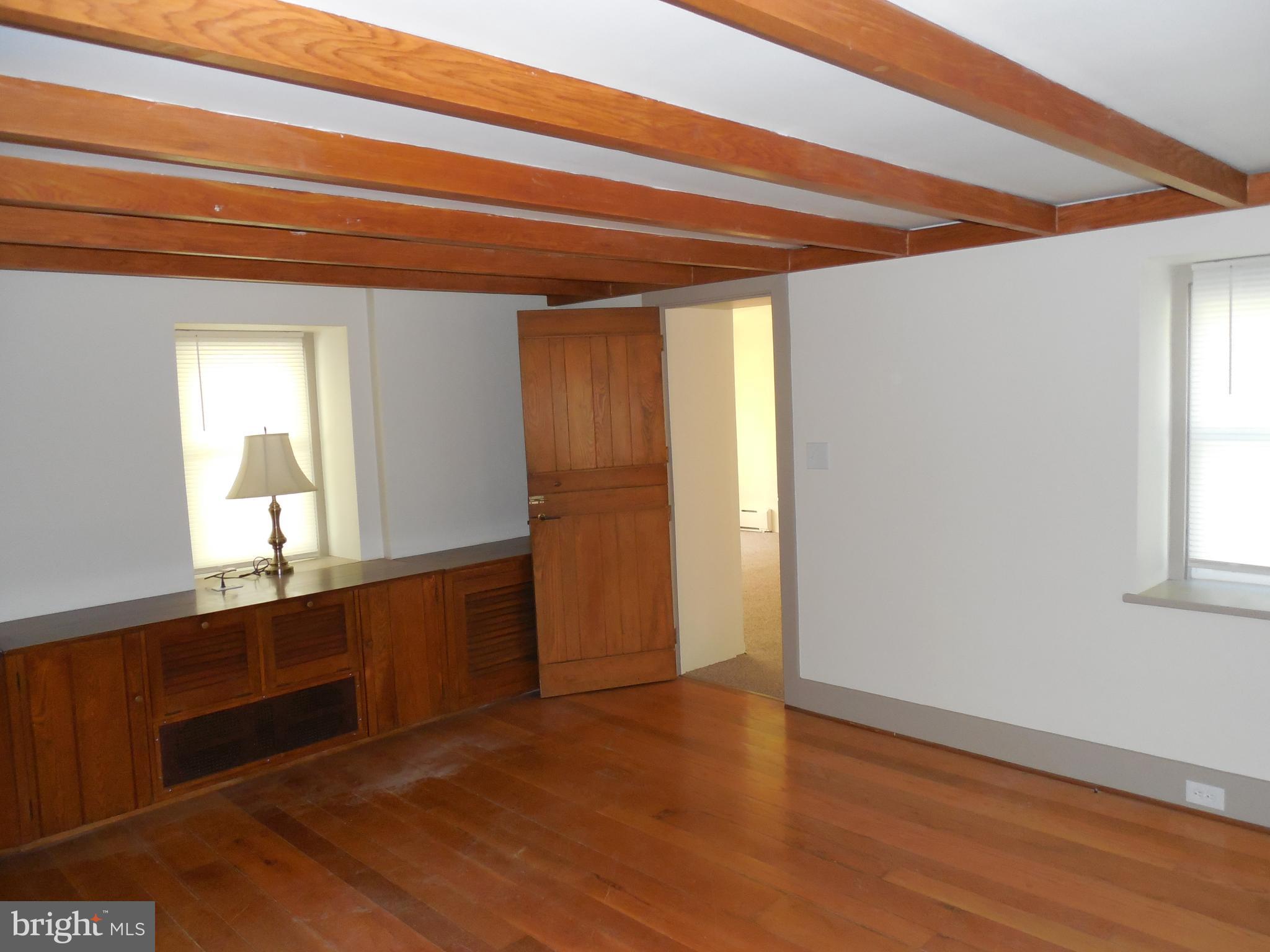 20 Camp Rock Hill Road Quakertown, PA 18951 - Photo 7 of 27 a view of an empty room with wooden floor and a window