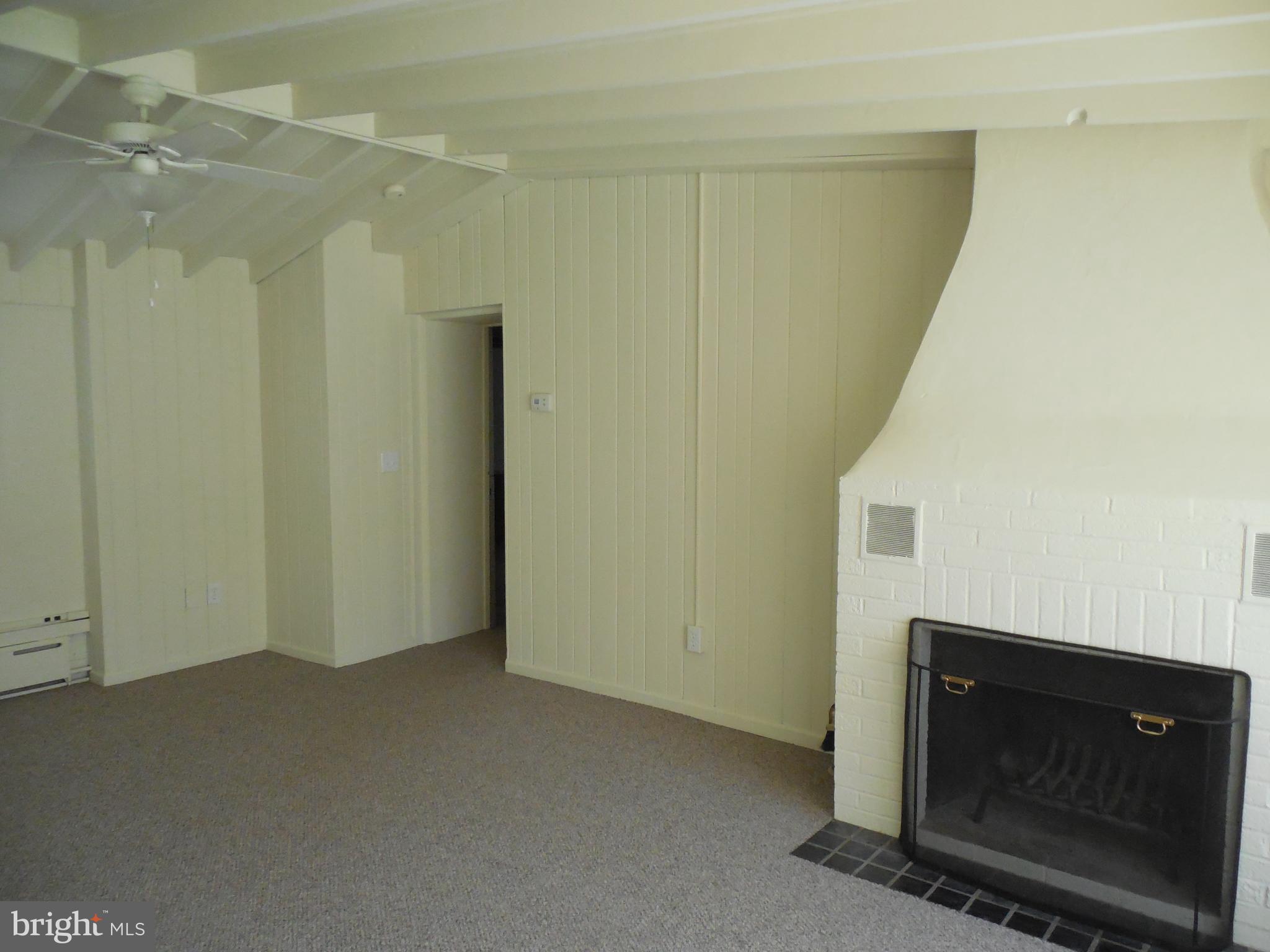 20 Camp Rock Hill Road Quakertown, PA 18951 - Photo 8 of 27 a view of an empty room with wooden floor and a fireplace