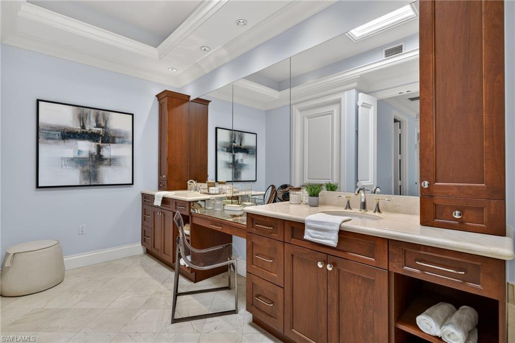 625 5th Avenue South, Unit PH302 Naples, FL 34102 - Photo 18 of 33 Full bathroom featuring double vanity, ornamental molding, and a tray ceiling