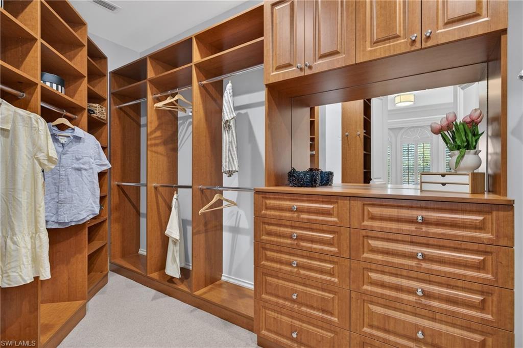 625 5th Avenue South, Unit PH302 Naples, FL 34102 - Photo 20 of 33 Walk in closet with light carpet