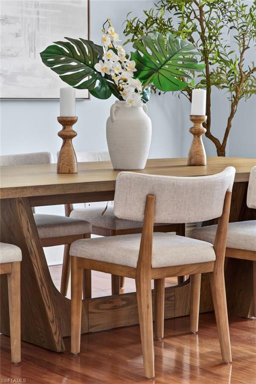 625 5th Avenue South, Unit PH302 Naples, FL 34102 - Photo 27 of 33 Dining room featuring wood finished floors