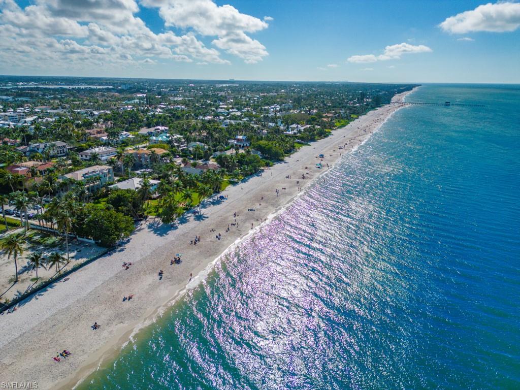 625 5th Avenue South, Unit PH302 Naples, FL 34102 - Photo 33 of 33 Aerial view of waterfront with a beach