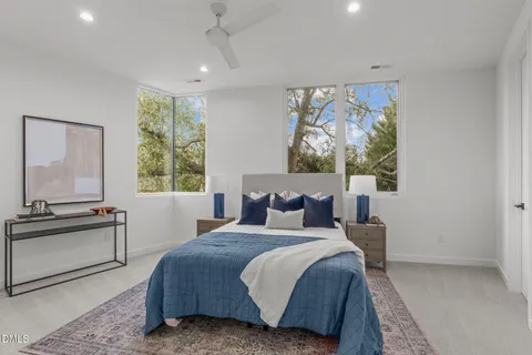 a bedroom with a large bed and a window