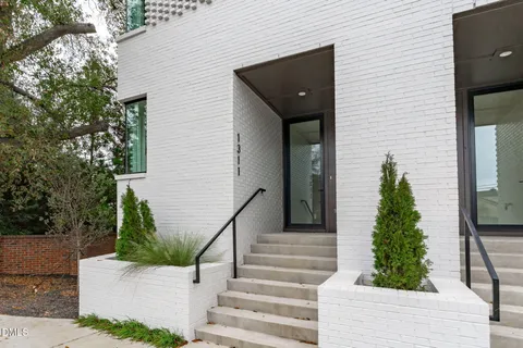 a building with trees in front of it