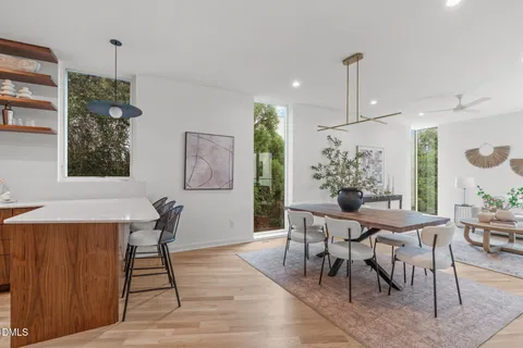 a view of a dining room with furniture window and wooden floor