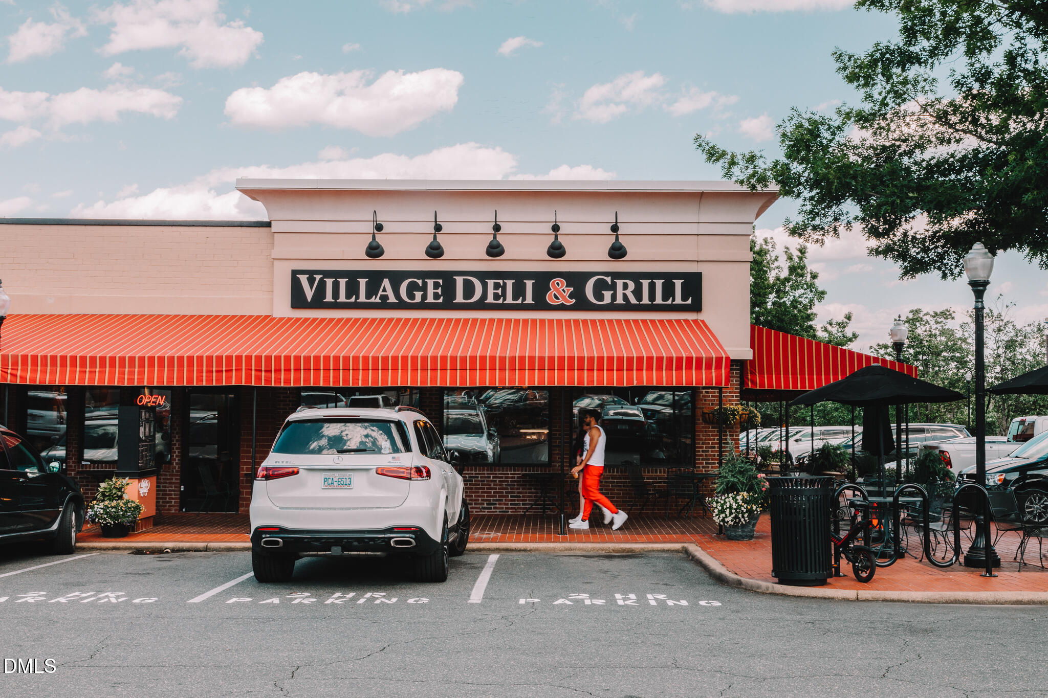 1307 Chamblee Hl Court Raleigh, NC 27608 - Photo 53 of 56 a car parked in front of a store