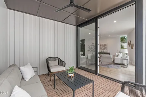 a living room with furniture and a rug