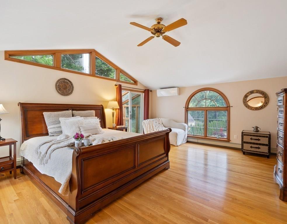 9 Northgate Road Wellesley, MA 02481 - Photo 14 of 32 a bedroom with a bed a dresser and wooden floor