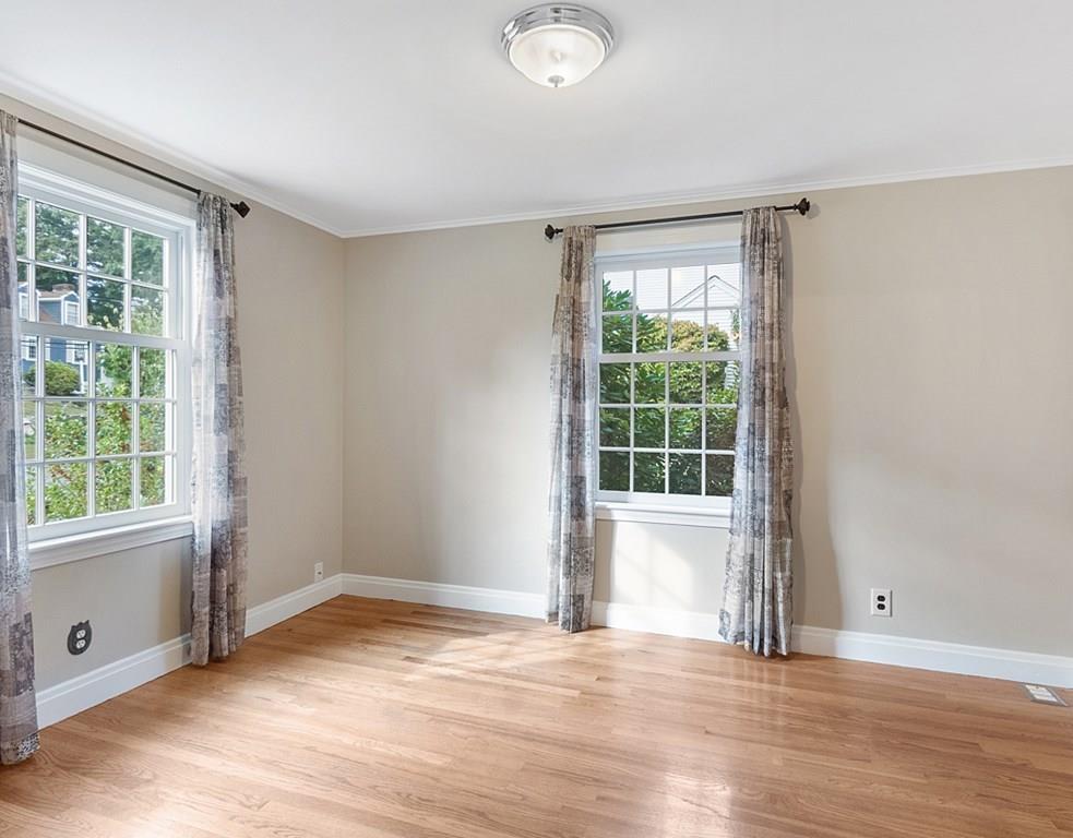 9 Northgate Road Wellesley, MA 02481 - Photo 19 of 32 a view of an empty room with wooden floor and a window