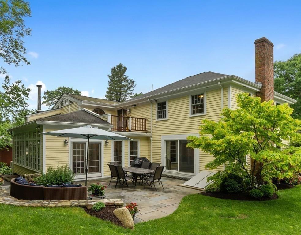 9 Northgate Road Wellesley, MA 02481 - Photo 2 of 32 a front view of a house with a yard and porch