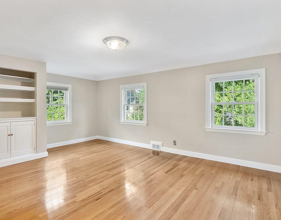 9 Northgate Road Wellesley, MA 02481 - Photo 23 of 32 an empty room with wooden floor and windows