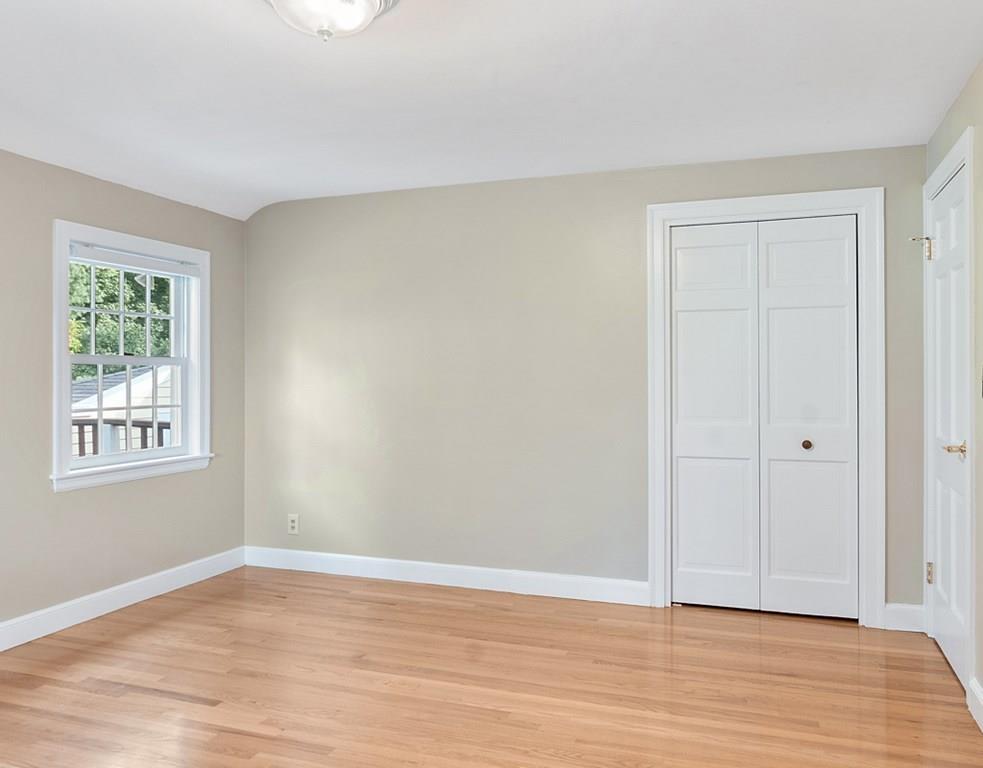 9 Northgate Road Wellesley, MA 02481 - Photo 24 of 32 a view of an empty room with wooden floor and a window