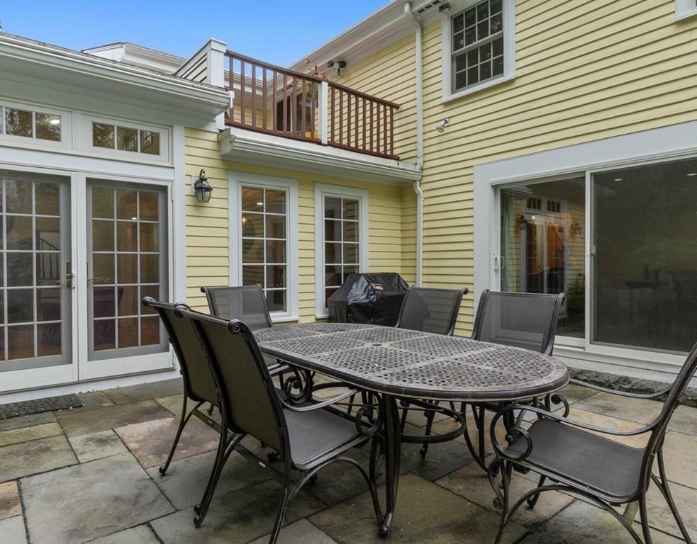 9 Northgate Road Wellesley, MA 02481 - Photo 27 of 32 a view of a house with a backyard and sitting area