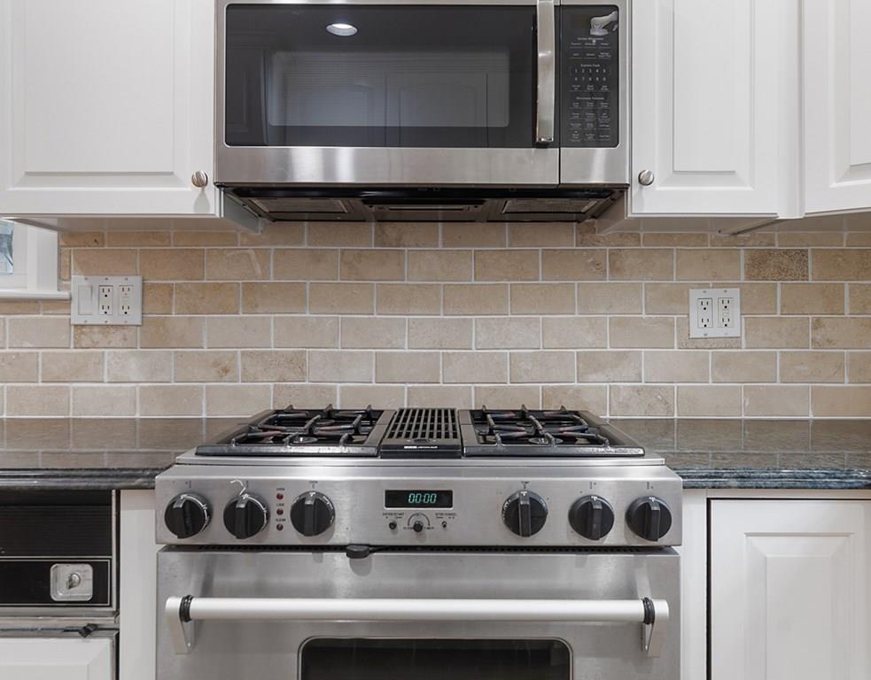 9 Northgate Road Wellesley, MA 02481 - Photo 8 of 32 a kitchen with a stove and cabinets