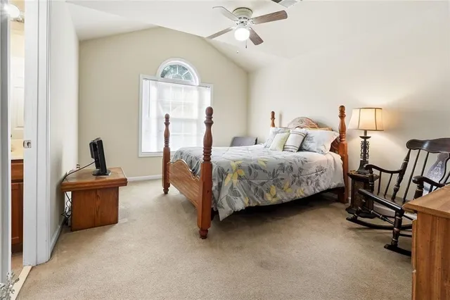 a bedroom with bed and a window