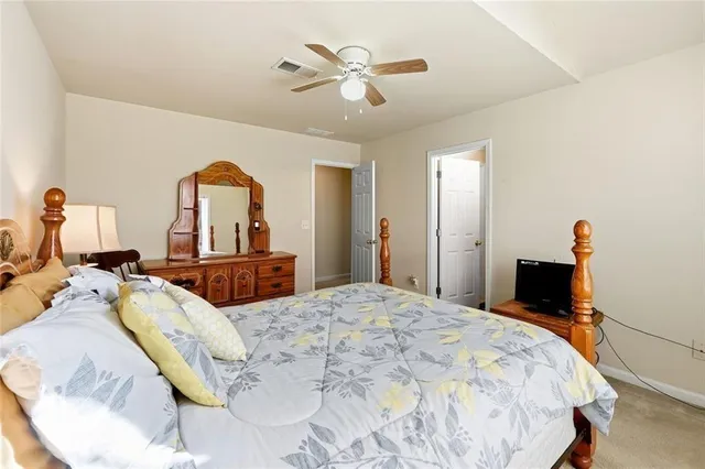 a bed room with a bed and a chandelier