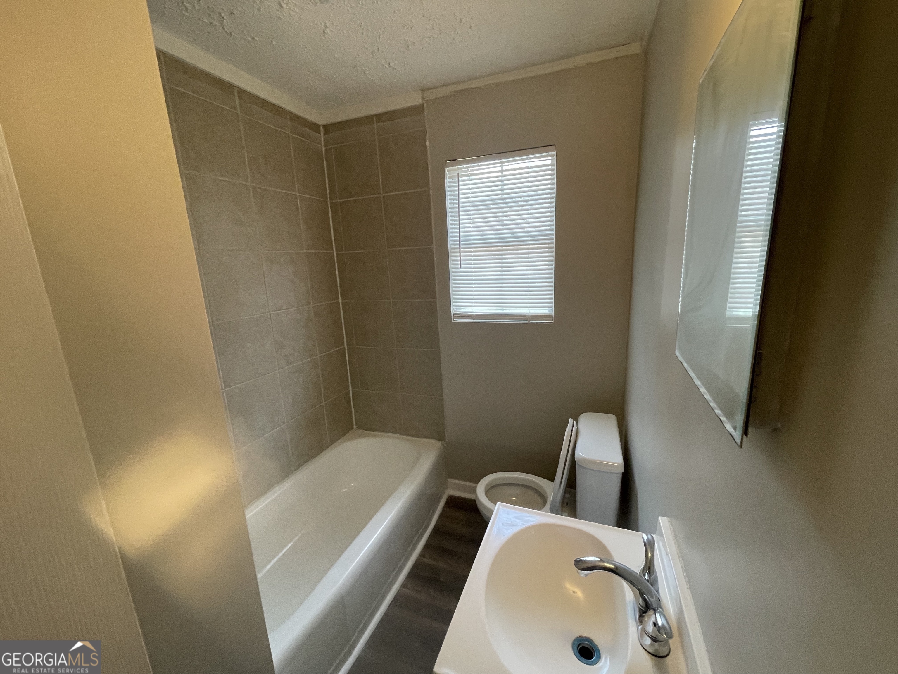 3620 Earl Street Macon, GA 31204 - Photo 3 of 5 a bathroom with a sink and a mirror