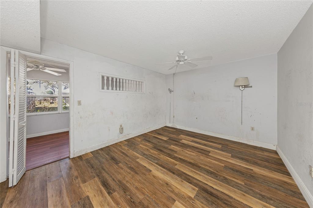 10032 65th Avenue North, Unit 9 St. Petersburg, FL 33708 - Photo 11 of 18 wooden floor in an empty room