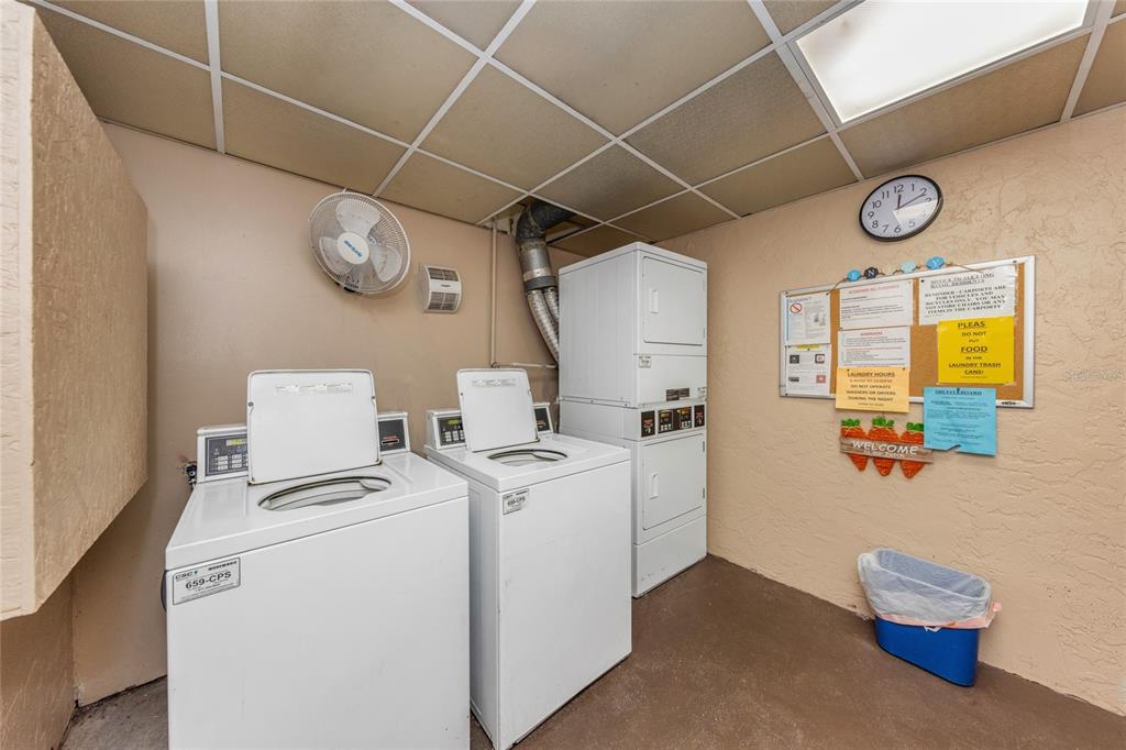 10032 65th Avenue North, Unit 9 St. Petersburg, FL 33708 - Photo 17 of 18 a view of storage and utility room with a washer and dryer