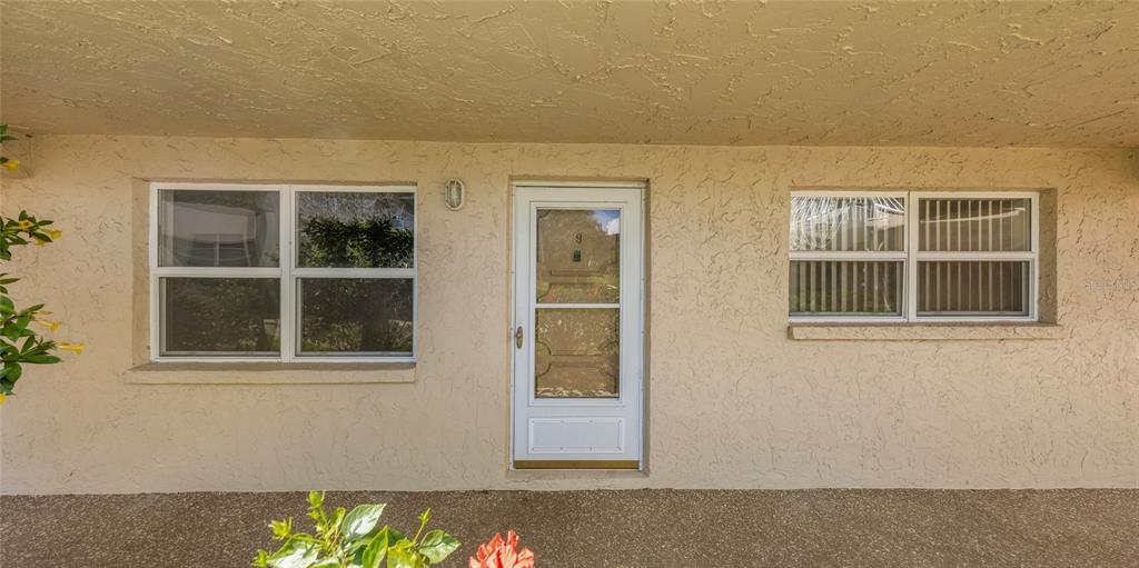10032 65th Avenue North, Unit 9 St. Petersburg, FL 33708 - Photo 3 of 18 a view of an empty room with a window