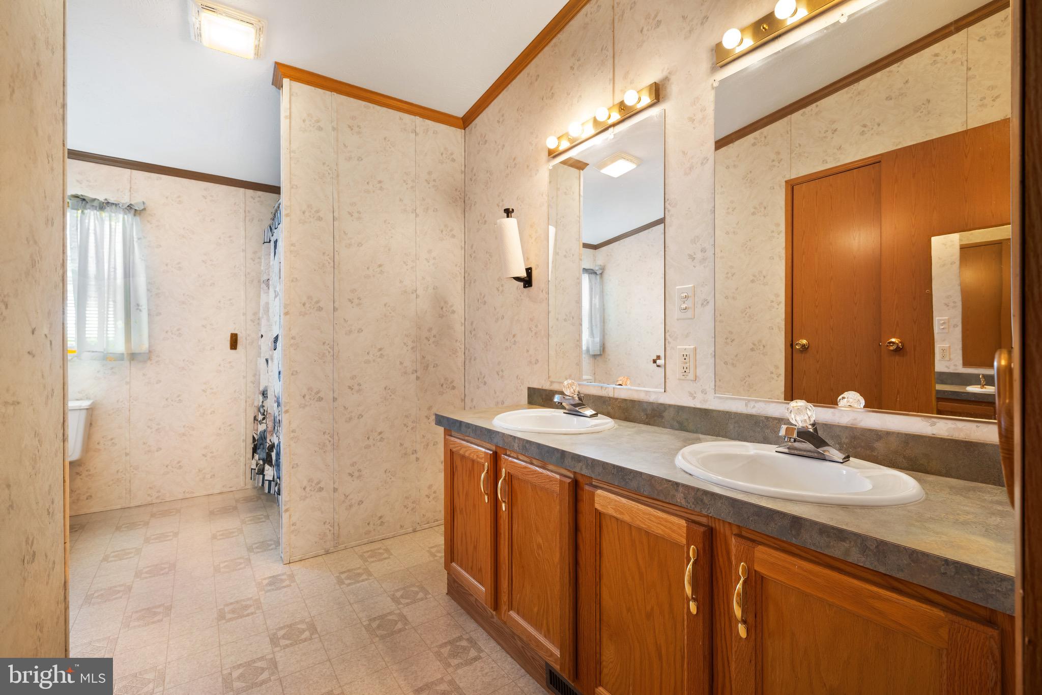 29 Oak Drive, Unit D Sicklerville, NJ 08081 - Photo 17 of 23 a bathroom with a sink a mirror and a shower