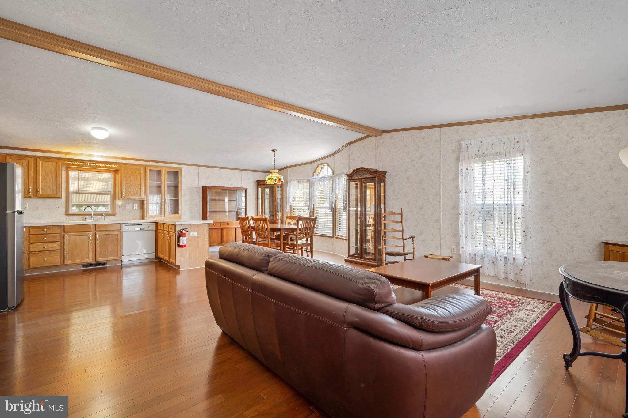 29 Oak Drive, Unit D Sicklerville, NJ 08081 - Photo 6 of 23 a living room with furniture and a wooden floor