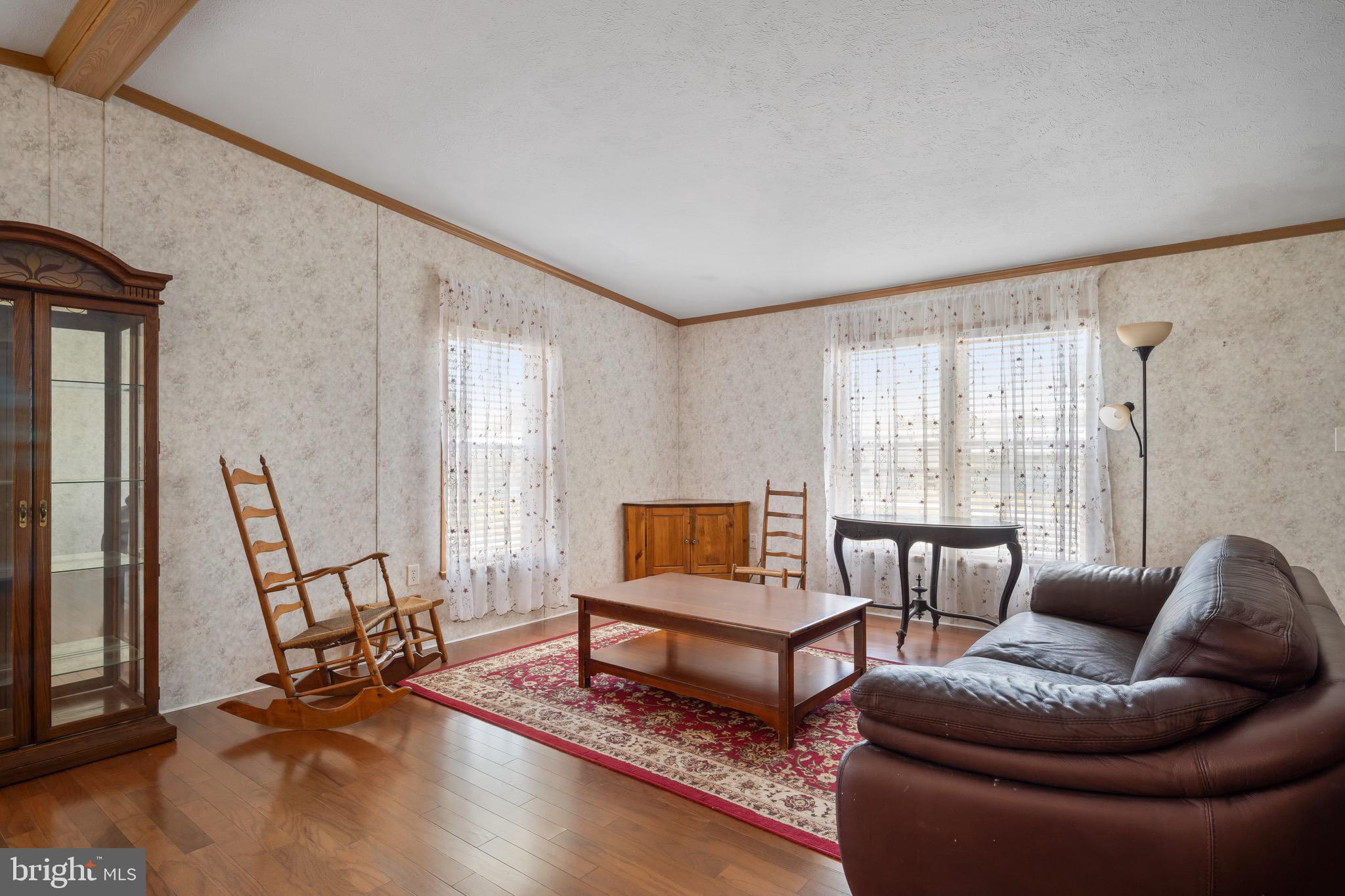 29 Oak Drive, Unit D Sicklerville, NJ 08081 - Photo 8 of 23 a living room with furniture and a wooden floor