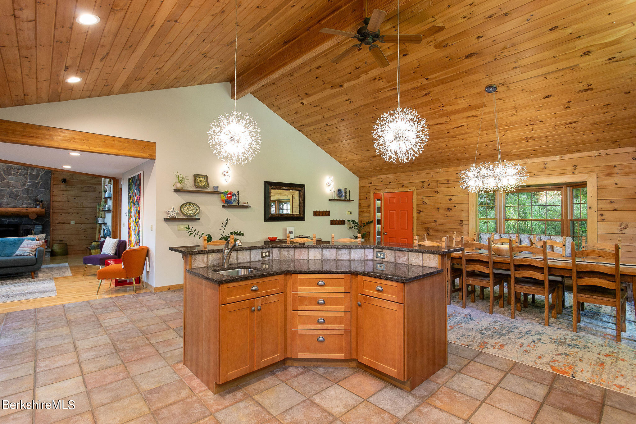 83 Main Road Monterey, MA 01230 - Photo 11 of 49 a very nice looking dining room with a large dining table and a large window with garden view