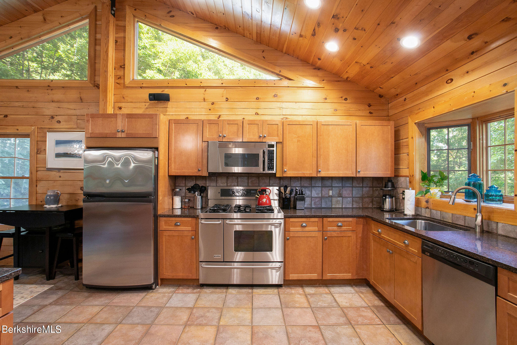 83 Main Road Monterey, MA 01230 - Photo 17 of 49 a kitchen with stainless steel appliances a stove a sink and a refrigerator