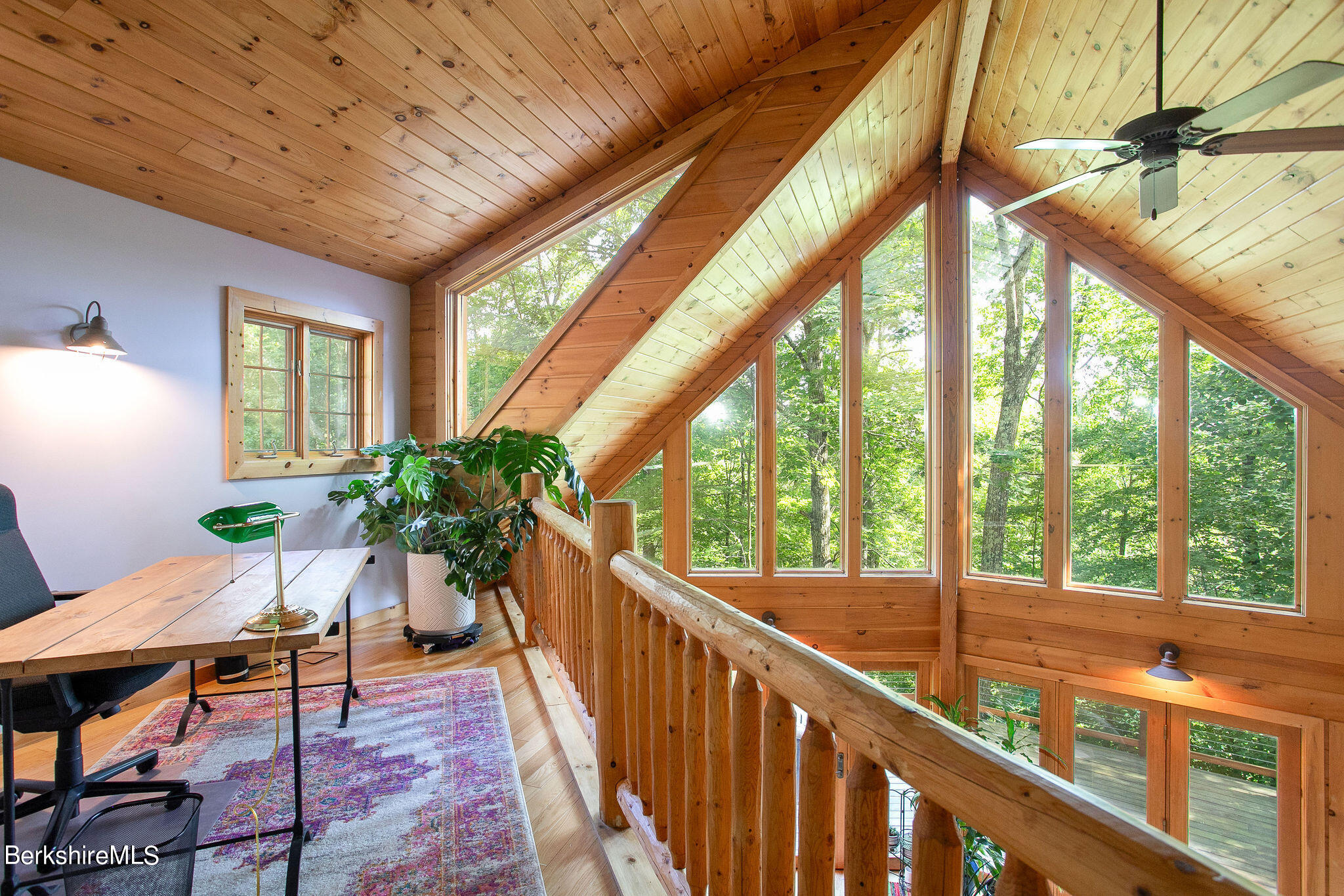 83 Main Road Monterey, MA 01230 - Photo 26 of 49 a view of a porch with chairs and wooden floor