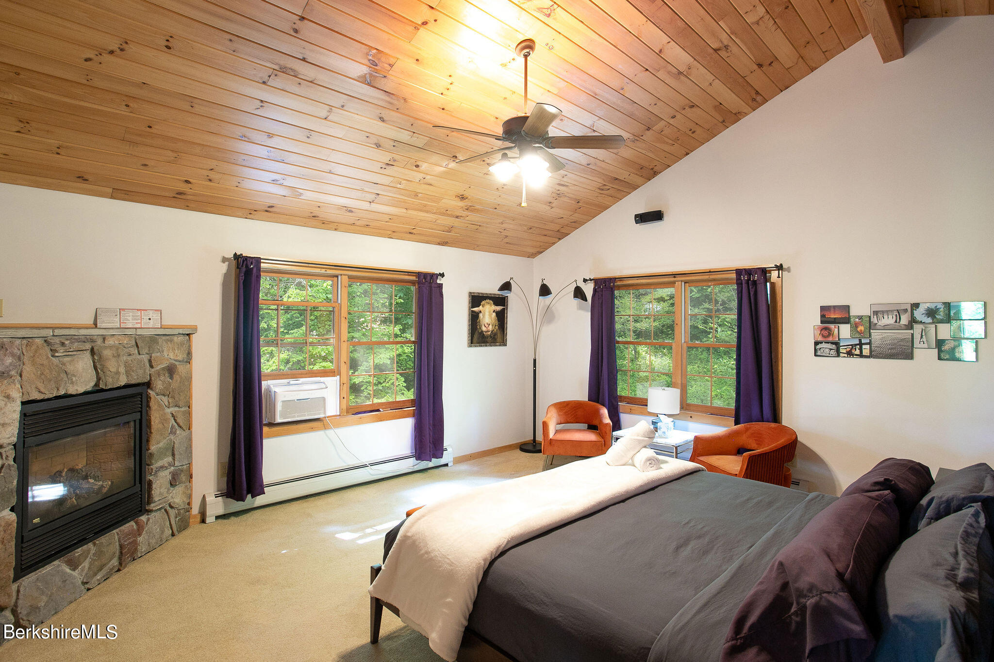 83 Main Road Monterey, MA 01230 - Photo 27 of 49 a bedroom with a bed and a fireplace