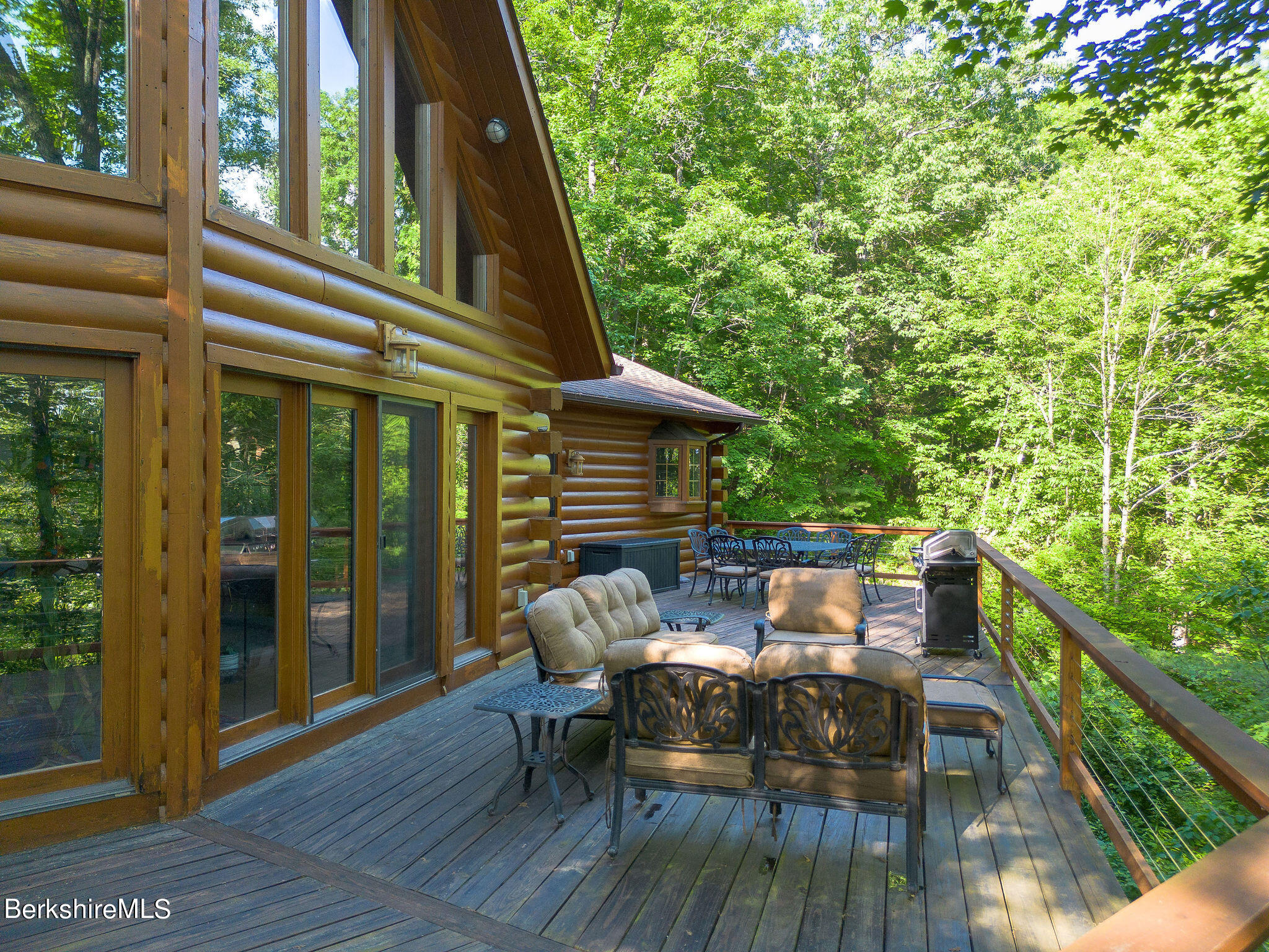 83 Main Road Monterey, MA 01230 - Photo 4 of 49 a view of deck with furniture and trees