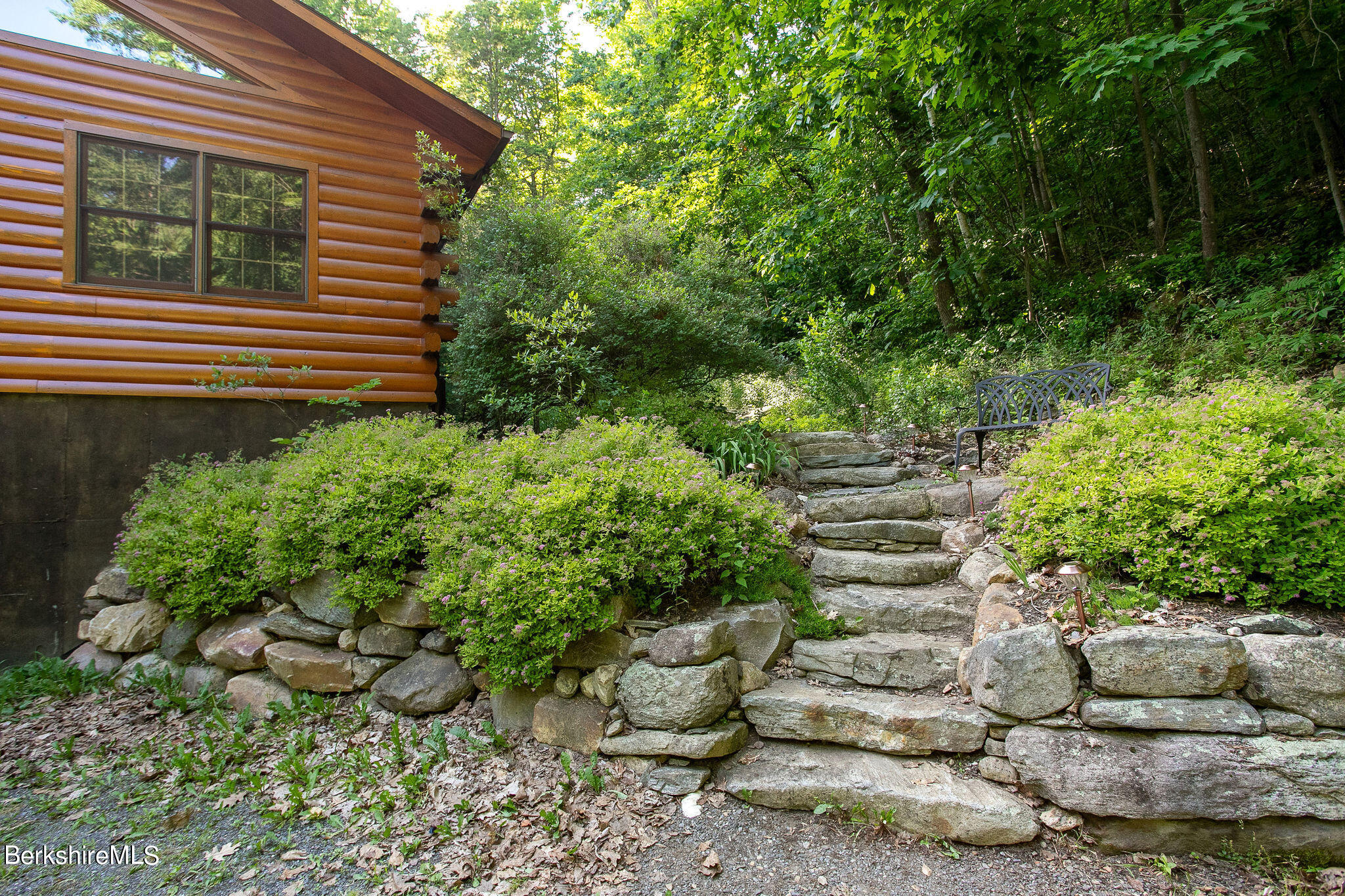 83 Main Road Monterey, MA 01230 - Photo 45 of 49 a view of a garden filled with plants