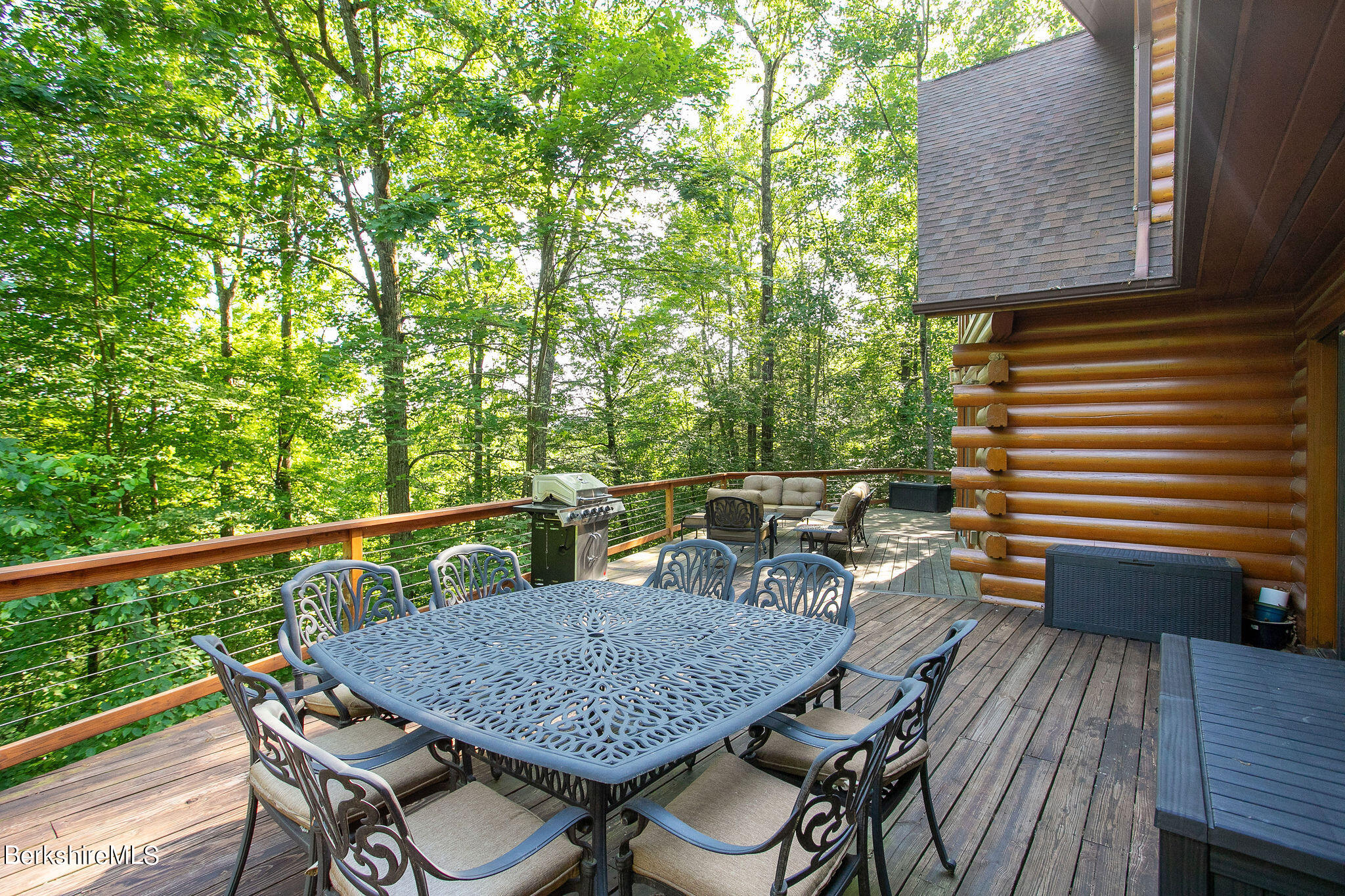 83 Main Road Monterey, MA 01230 - Photo 48 of 49 a roof deck with a table and chairs
