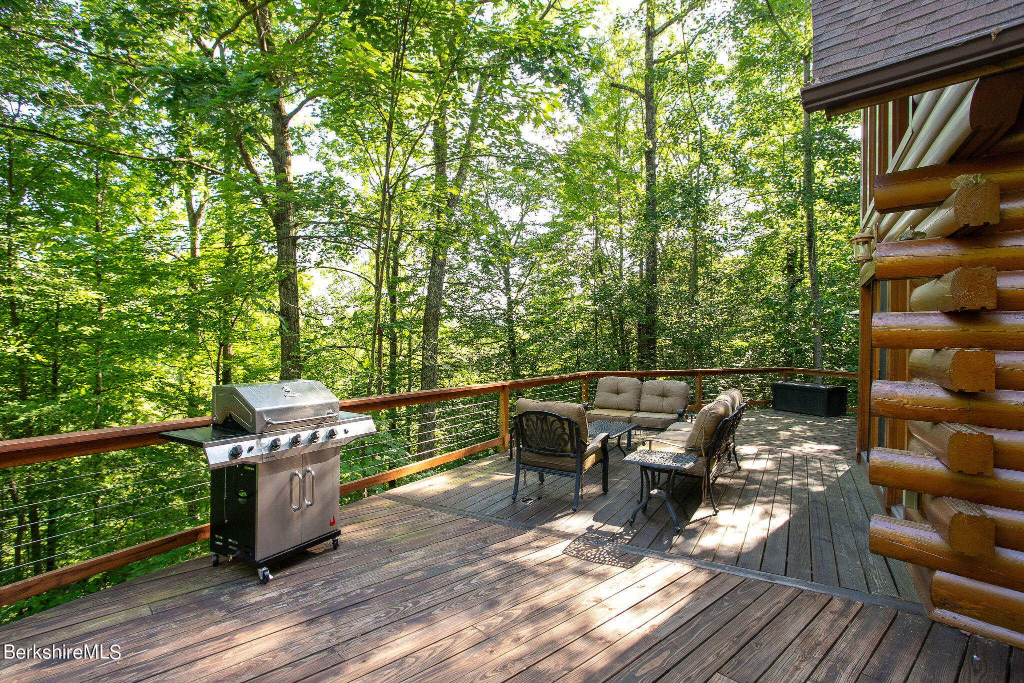83 Main Road Monterey, MA 01230 - Photo 49 of 49 a roof deck view with table and chairs and wooden floor
