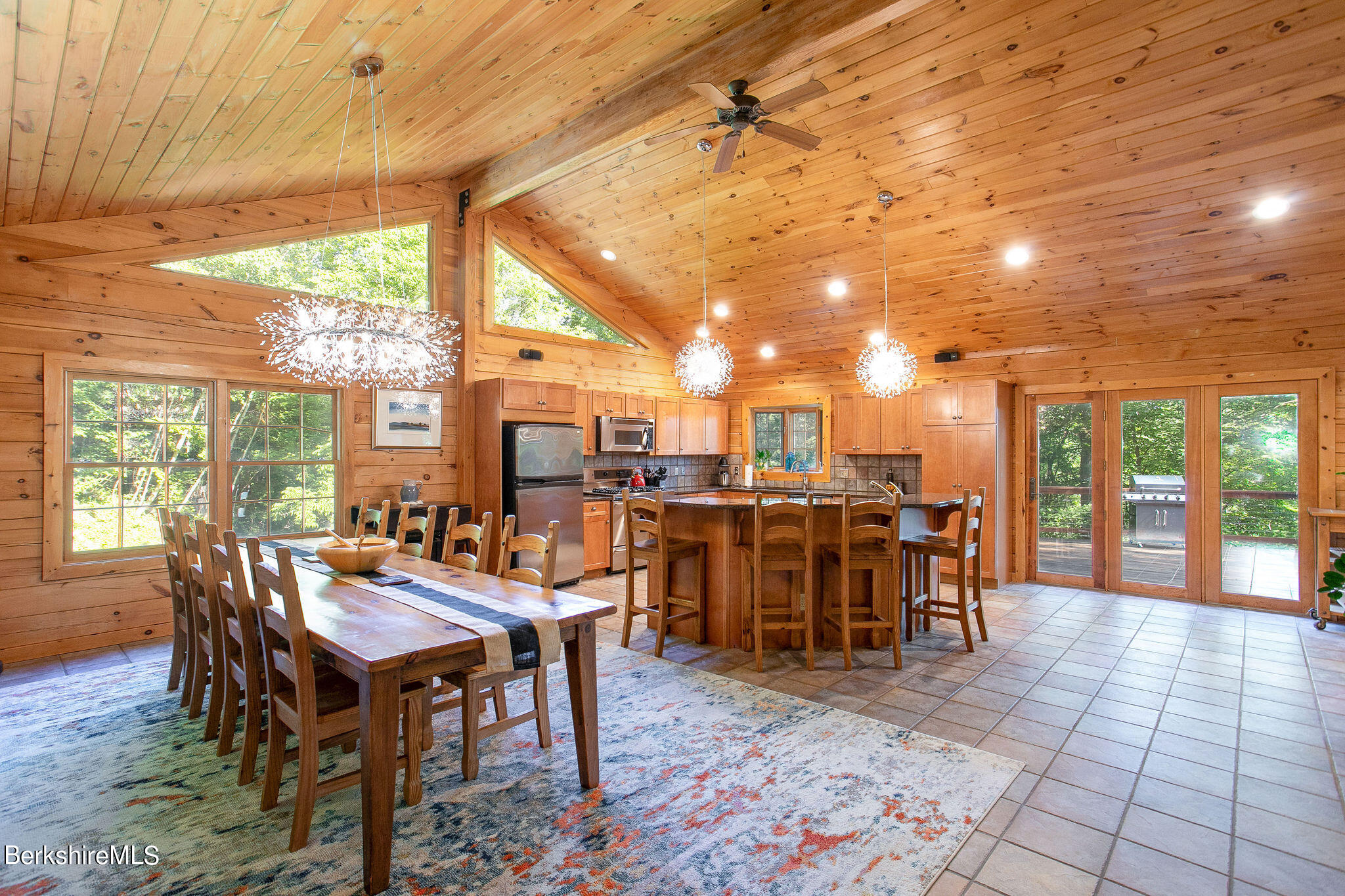 83 Main Road Monterey, MA 01230 - Photo 8 of 49 a dining room with furniture and a floor to ceiling window