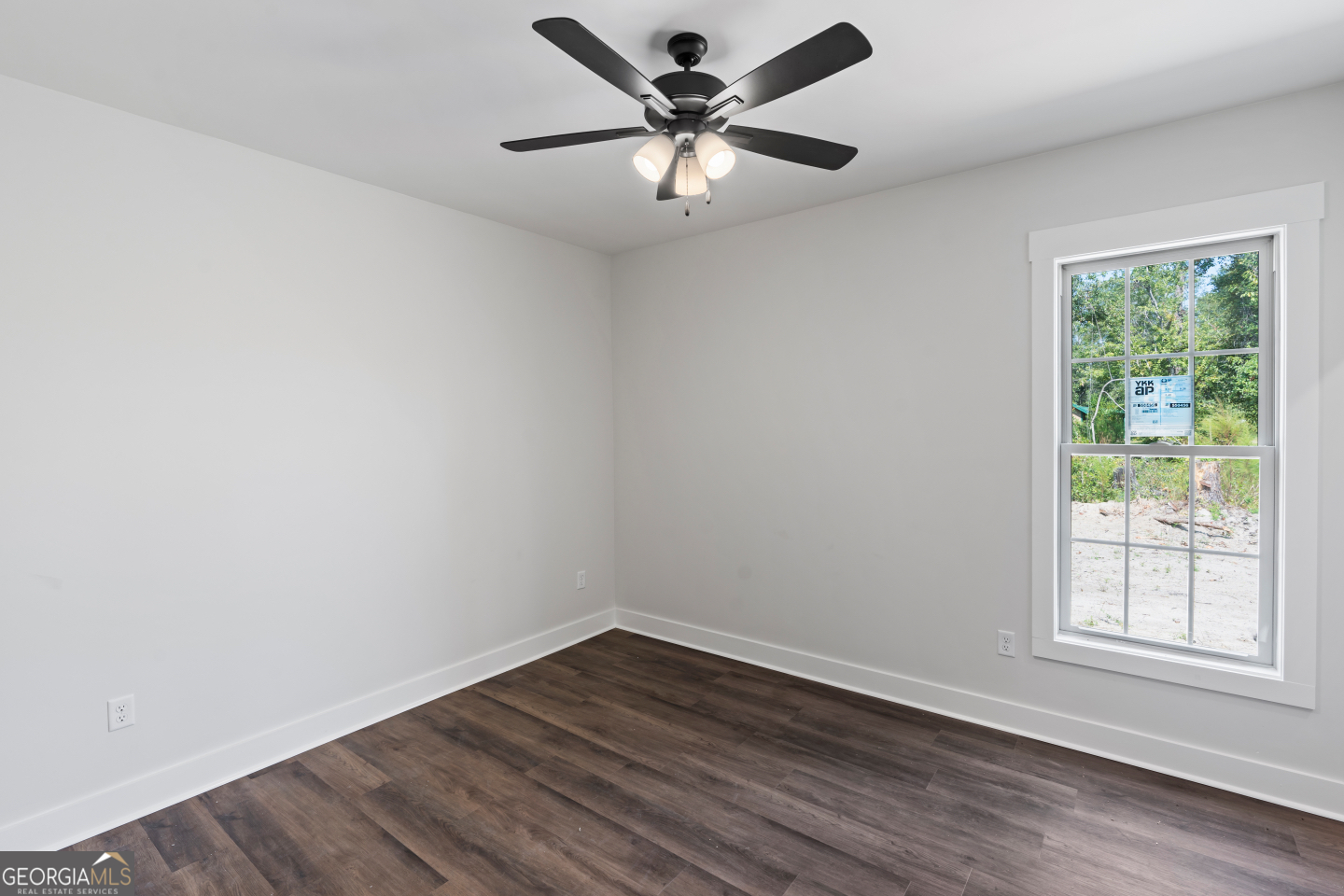 2830 Loch Laurel Road Valdosta, GA 31601 - Photo 16 of 40 wooden floor in an empty room with a window