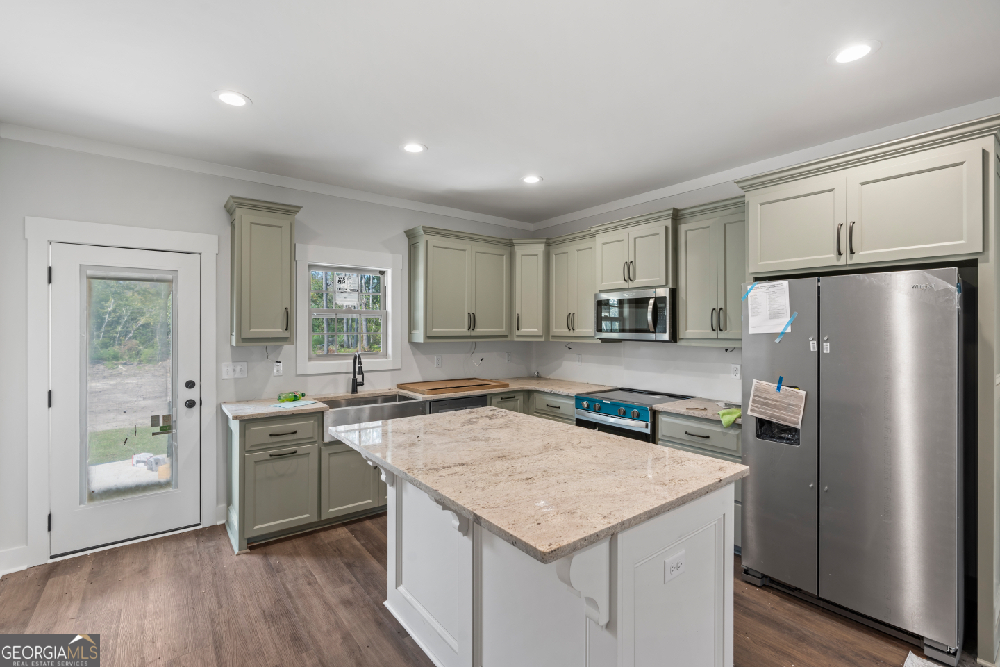 2830 Loch Laurel Road Valdosta, GA 31601 - Photo 2 of 40 a kitchen with stainless steel appliances granite countertop a sink stove and refrigerator