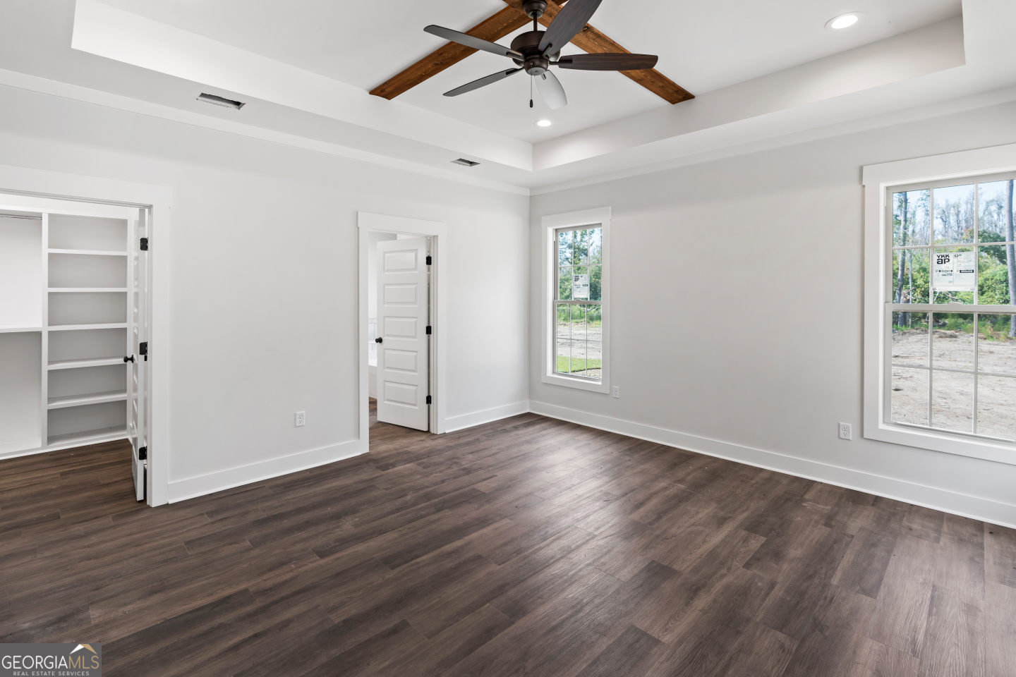 2830 Loch Laurel Road Valdosta, GA 31601 - Photo 21 of 40 wooden floor in an empty room with a window