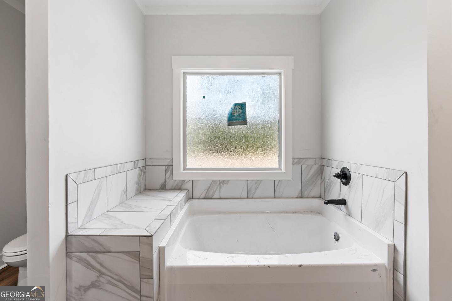 2830 Loch Laurel Road Valdosta, GA 31601 - Photo 25 of 40 a bathroom with a bath tub and a window