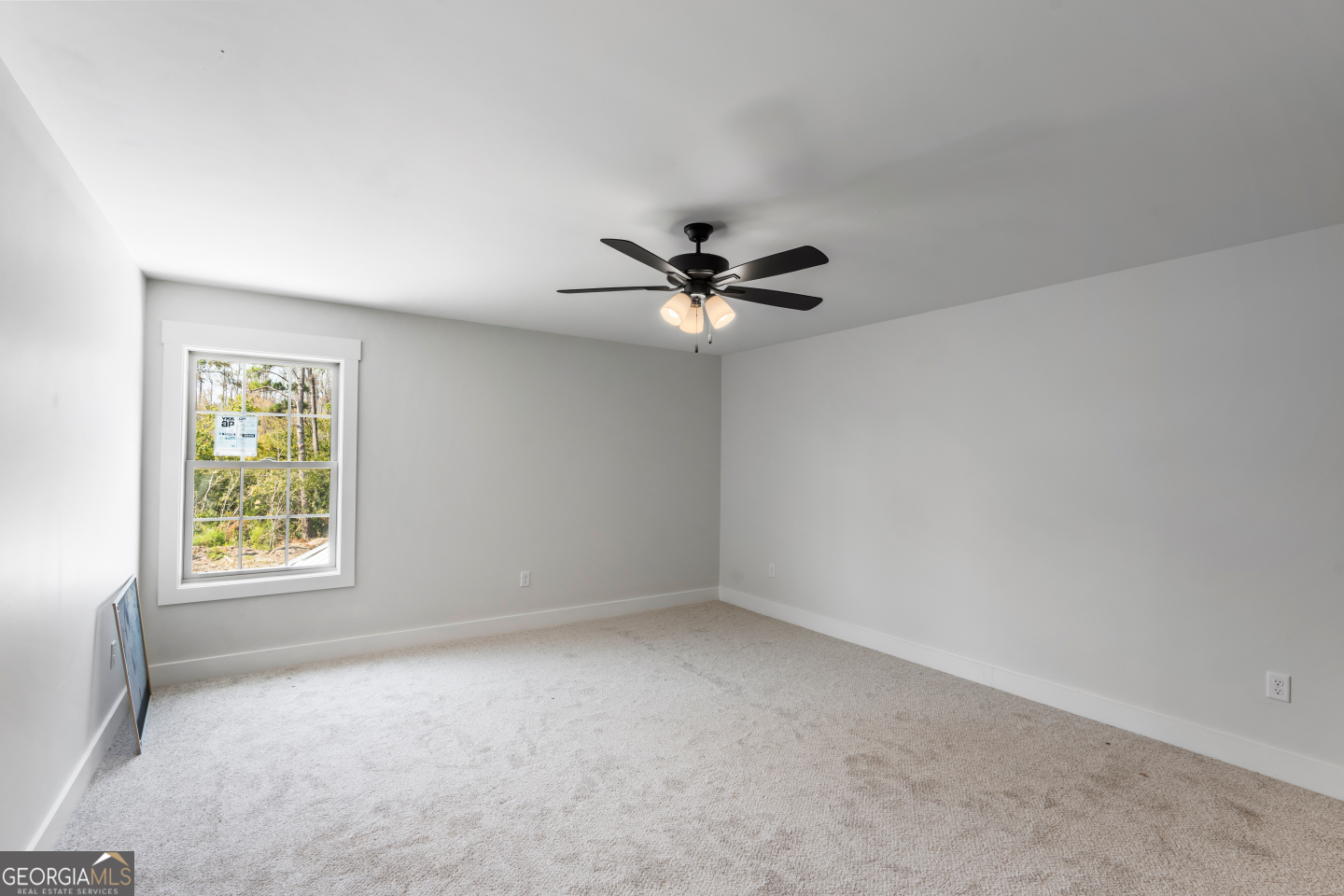 2830 Loch Laurel Road Valdosta, GA 31601 - Photo 29 of 40 an empty room with a window and a fan