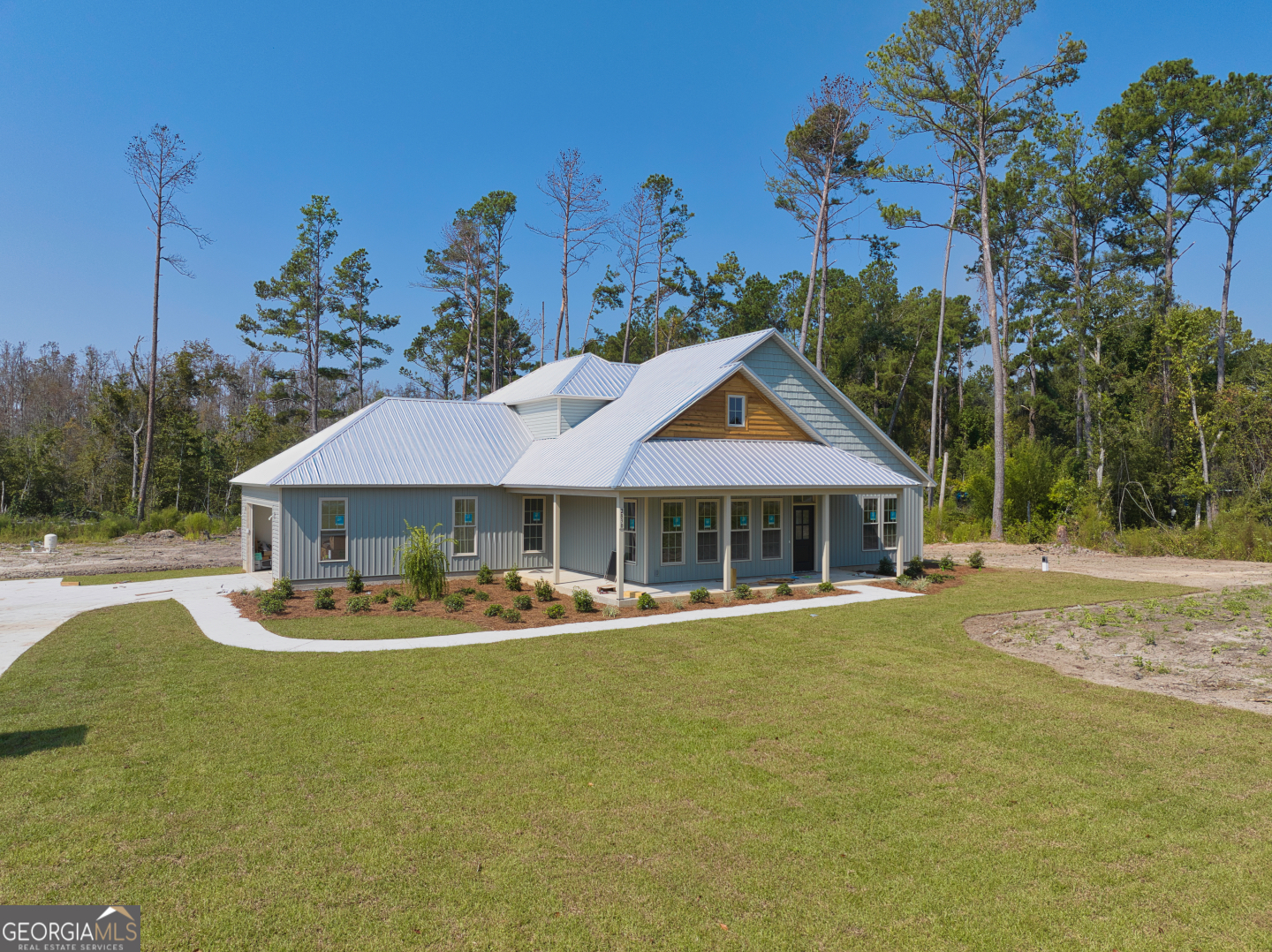 2830 Loch Laurel Road Valdosta, GA 31601 - Photo 32 of 40 a front view of a house with a garden and yard