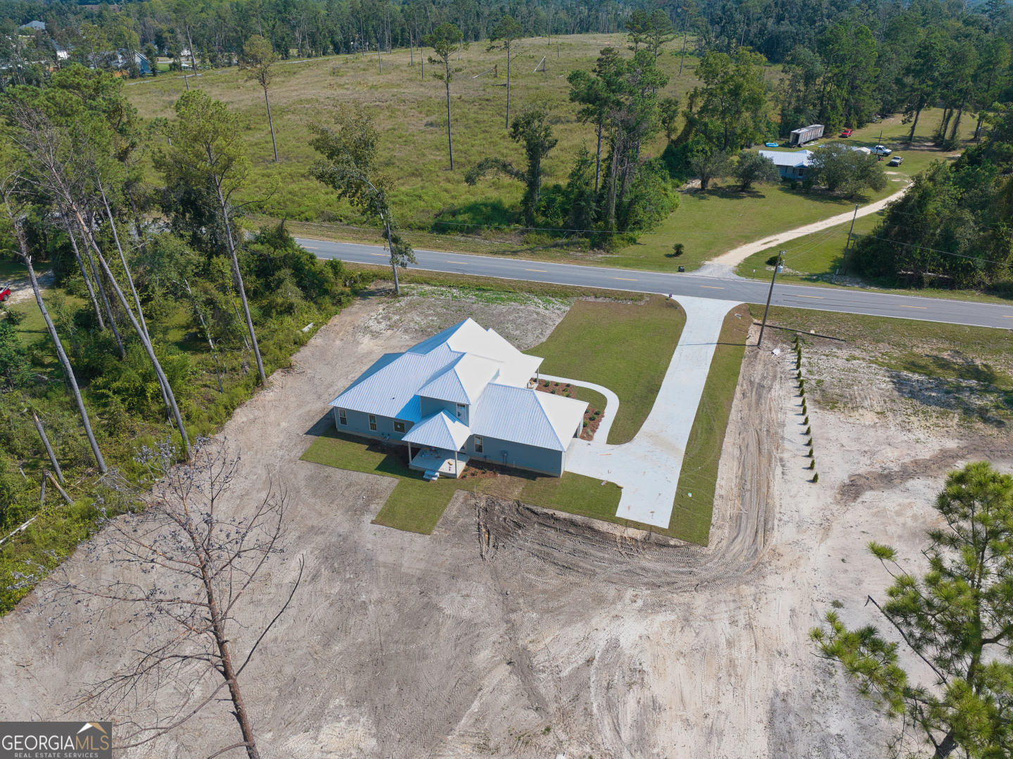2830 Loch Laurel Road Valdosta, GA 31601 - Photo 35 of 40 an aerial view of a house with a yard and lake