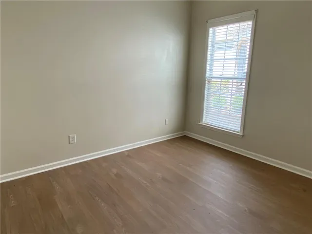 a bathroom with a double vanity sink a toilet and a mirror