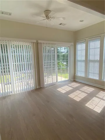 a view of a swimming pool with chair and table