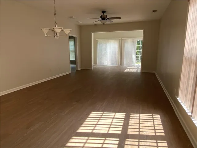 a view of empty room with windows