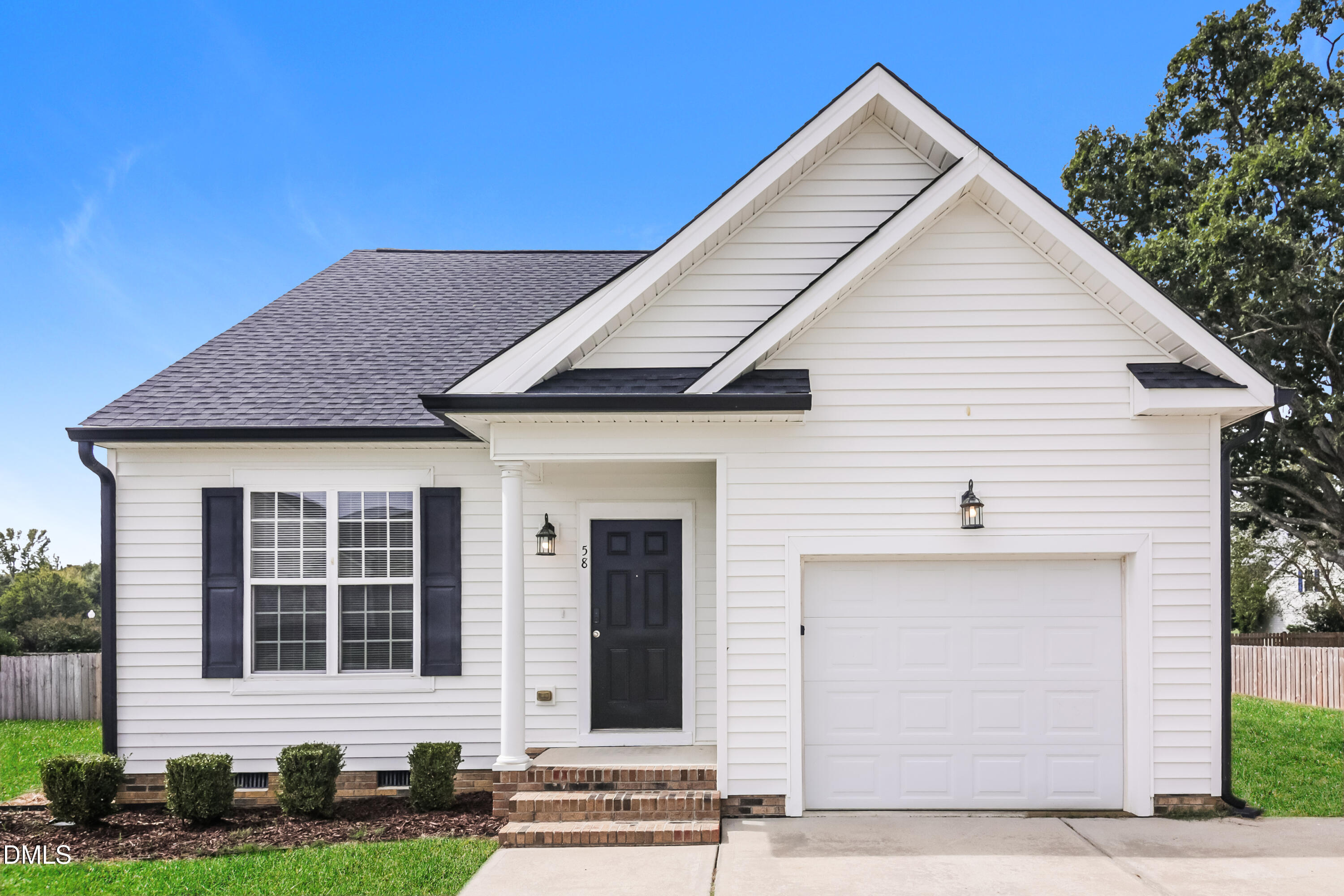 58 Magnolia Vine Lane Smithfield, NC 27577 - Photo 1 of 17 a view of the house with yard and plants